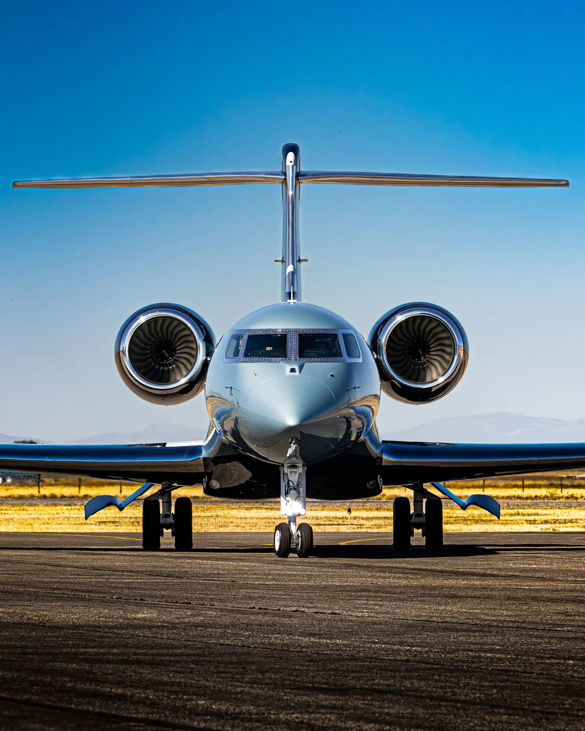 Private jet viewed head-on on a clear day